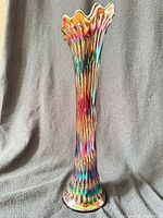 Full view of tall iridescent cobalt blue hobnail vase