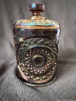 Front view of iridescent carnival glass biscuit jar