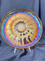 Front view of entire iridescent wide panel bowl on stand
