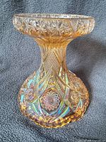 Full view of iridescent carnival glass pedestal base