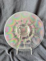 Front of iridescent Wide Panel stretch glass plate on stand