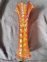 Full frontal view of the 8-inch marigold carnival glass Ripples vase