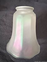 Front view of frosted iridescent shade showing shape and colour