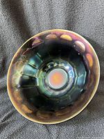 Interior of bowl showing iridescent colors and wide panel pattern