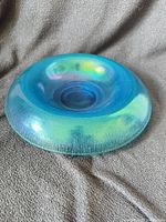 Top view showing teal color and iridescent surface