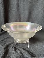 Full view of iridescent stretch glass bowl on stand