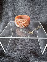 Salt cellar and spoon on clear stand