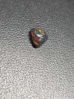 Top view of opal showing triangular shape and play of colour