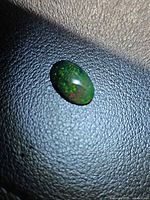 Top view of the Ethiopian black opal showing play-of-color