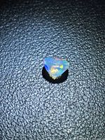 Top view of faceted opal showing play-of-color