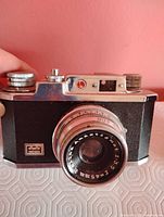 Vintage 35 mm film camera front view showing lens details