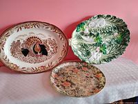 Three platters – turkey, bunny leaf, floral – front view