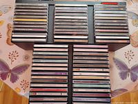 Front view of stacked collection of 66 CD jewel cases