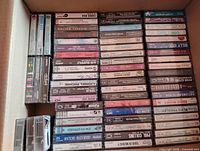 Box of roughly half the tapes spine-up showing artist names