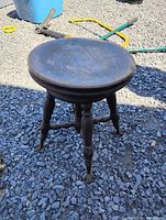 Full view of stool on gravel
