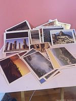 Fronts of assorted color postcards spread on table