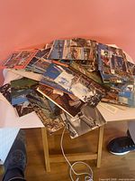 Large pile of assorted postcards showing variety of fronts