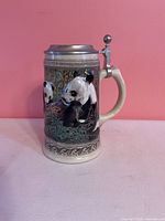 Front view of ceramic panda beer stein showing design and overall form