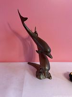 front view showing full twin dolphin form and base