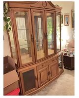 Full view of oak china cabinet showing hutch and base