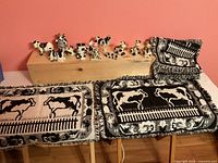 Placemat stack and figurines on wooden block