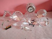 Group shot showing clock and ten crystal pieces