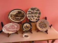 Front view of all six plates on stands