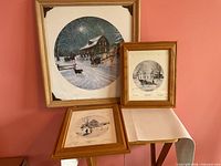 All three framed signed Kevin Dodds winter scene prints displayed together