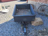 Front view of steel dump trailer attached to tongue