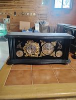 front view showing all four dials and decorative details