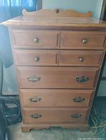 front view showing five drawers and hardware