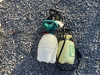 Both sprayers showing overall condition and included hoses and wands