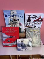 Front view of all five books standing upright