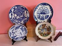 All four souvenir plates front view