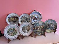 Full group of six scenic plates on stands