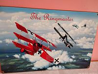 Full view of tin sign with WWI planes and title