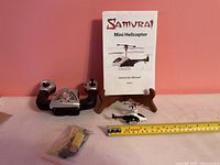 helicopter, controller, USB cable, instruction manual, scale