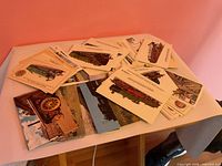 Stack of assorted 4 x 6 train postcards spread on table