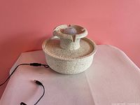 Complete fountain showing top detail and power cord