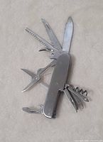 Pocket knife open showing multiple tools