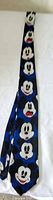 Full length of necktie showing Mickey Mouse face pattern