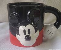 Front view showing Mickey face relief and glove handle