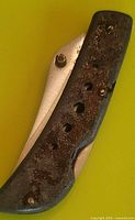 Knife closed showing corroded handle scale