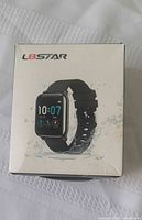 Front of box showing L8STAR branding and watch image