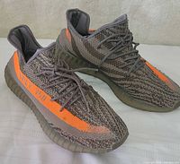 Side view of both shoes showing colorway and condition