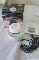 Speaker, cables, manual and retail box front