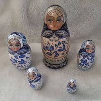 Front view of all five assembled dolls