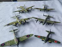 Oblique view of all six aircraft showing camouflage paint and propellers