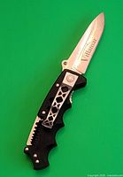 Knife fully opened showing Villamar etch, blade shape, handle detail