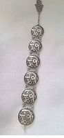 Full view of six-medallion bracelet with Hamsa charm